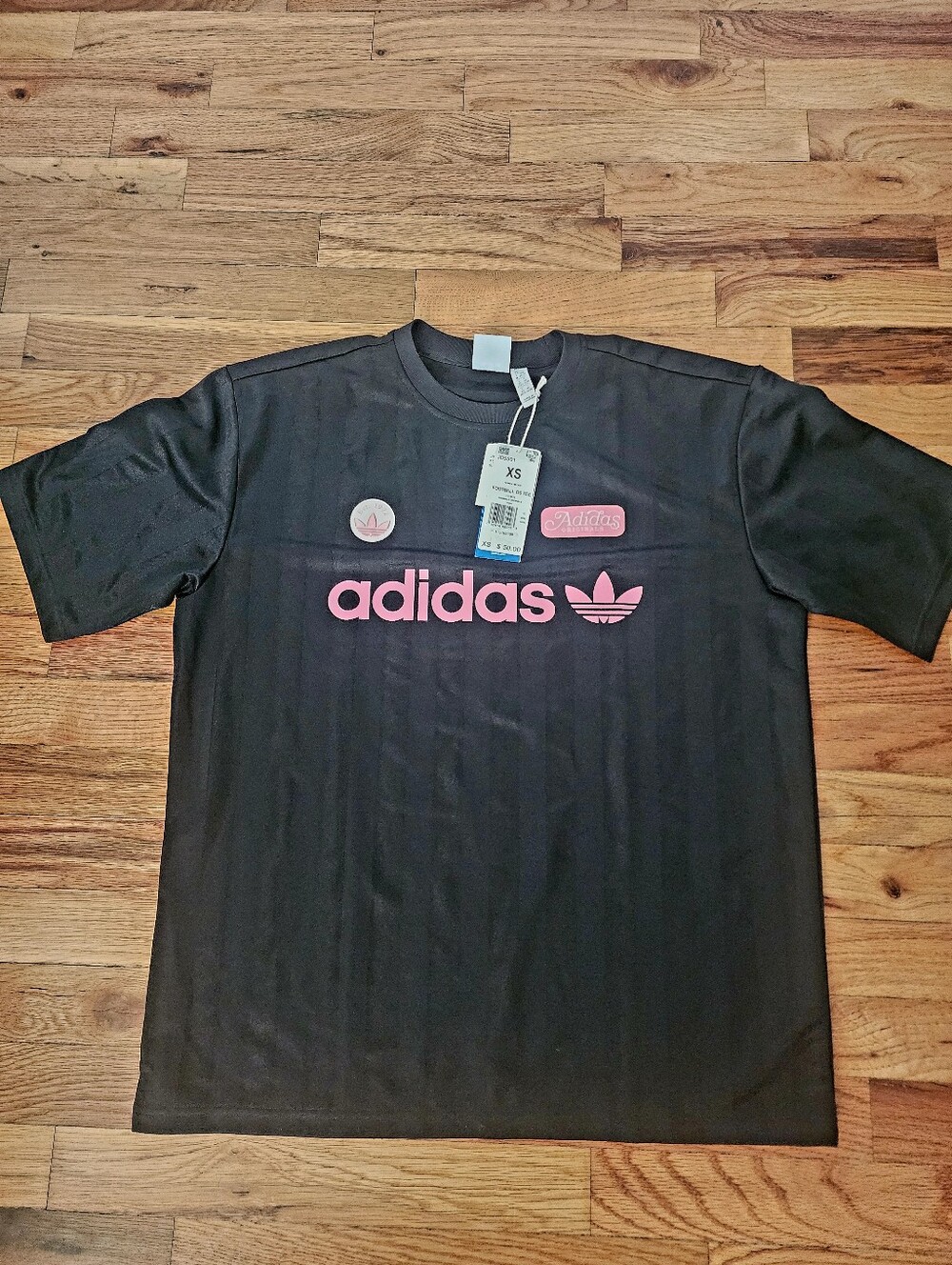OVERSIZED. FITS LIKE A SMALL. Adidas Black Short Sleeve Tee with Pink Logo